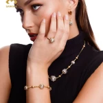 Opulent Charm: Luxurious 18k Gold Set with Intricate Ball Design